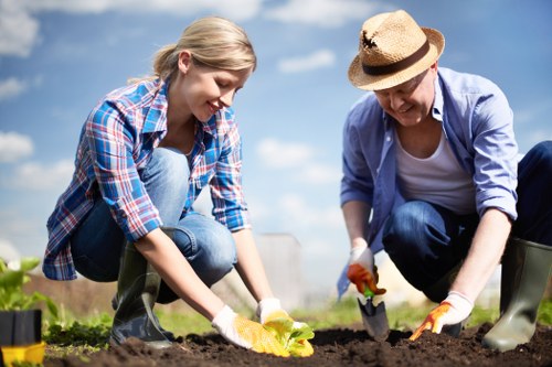 Local planting experts preparing a landscaped outdoor space in Kingston upon Thames